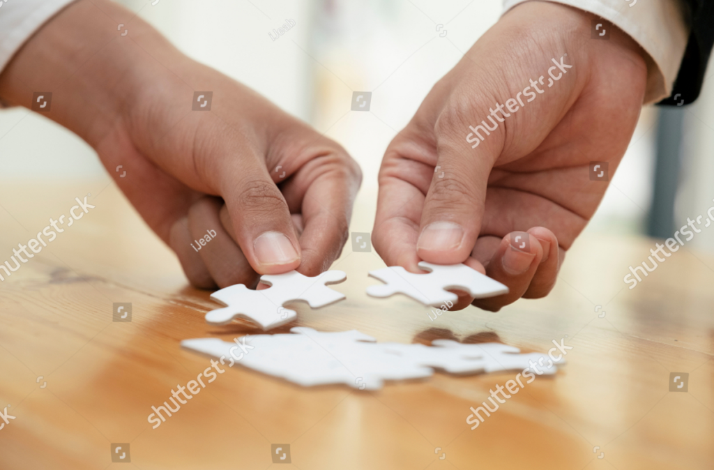 stock-photo-hands-holding-jigsaw-puzzles-business-partnership-and-teamwork-concept-1495070081